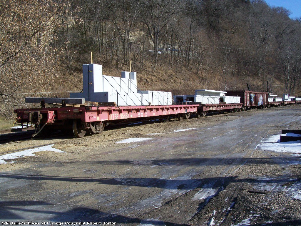 Pre-Cast Concrete Products Sit on a Siding