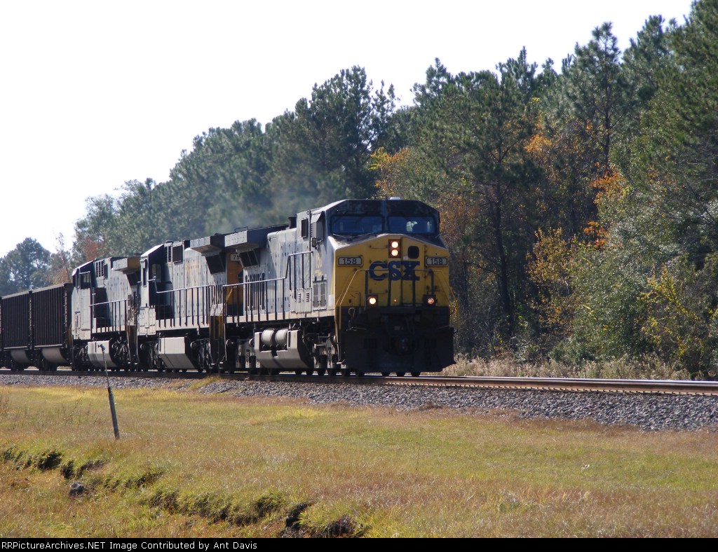CSX 158 brings an empty coal train into town