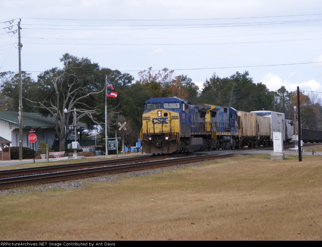 Wider view of CSX 7801 and its train