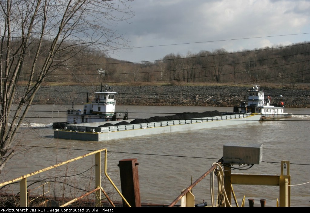 tugs Joet and Megan Elizabeth work together to spin a barge