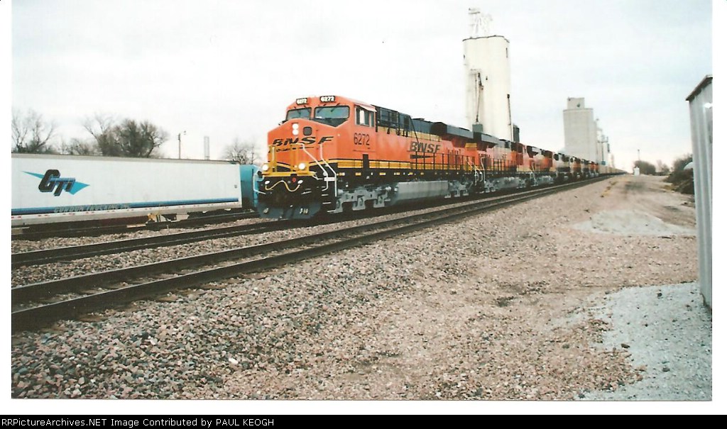 BNSF 6272 rolls past my truck and trailer going west with a empty coal train.