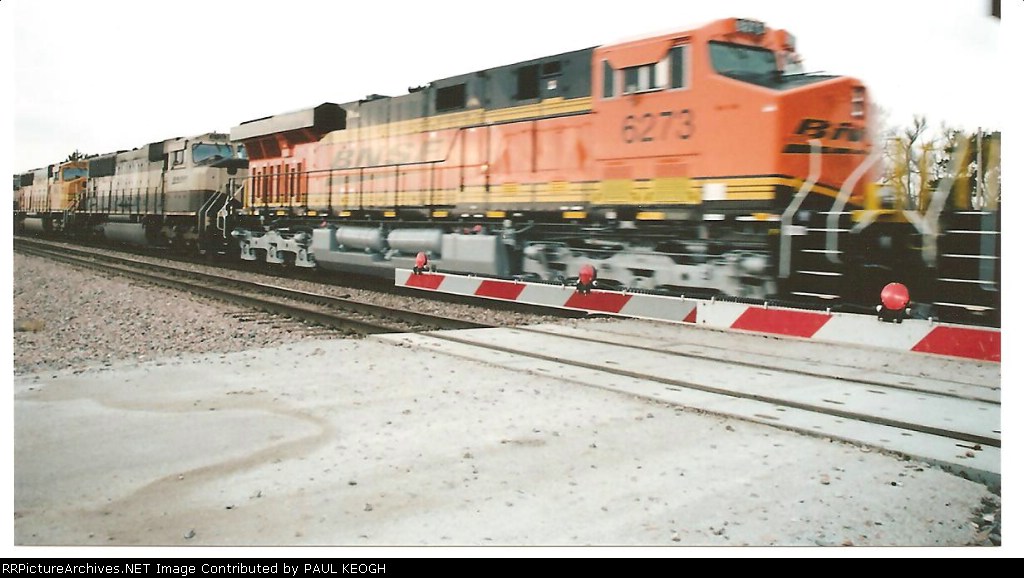 BNSF 6273 is a blur as she rolls west behind BNSF 6272