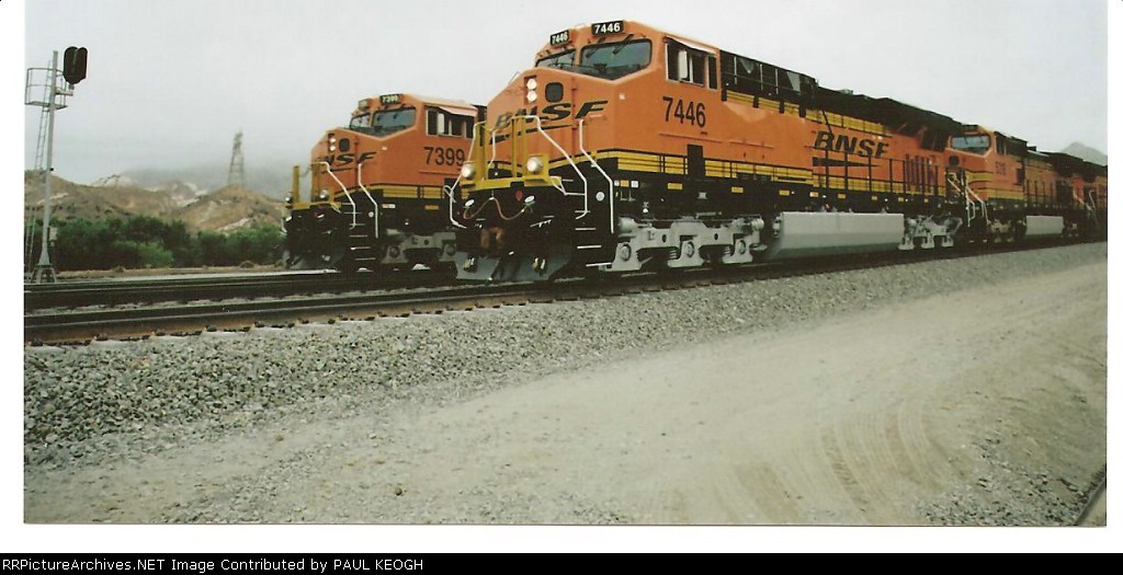 BNSF 7446 passes BNSF 7399 a rear DPU going east in Cajon Pass