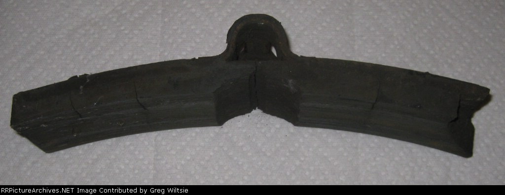 An old, discarded brake shoe