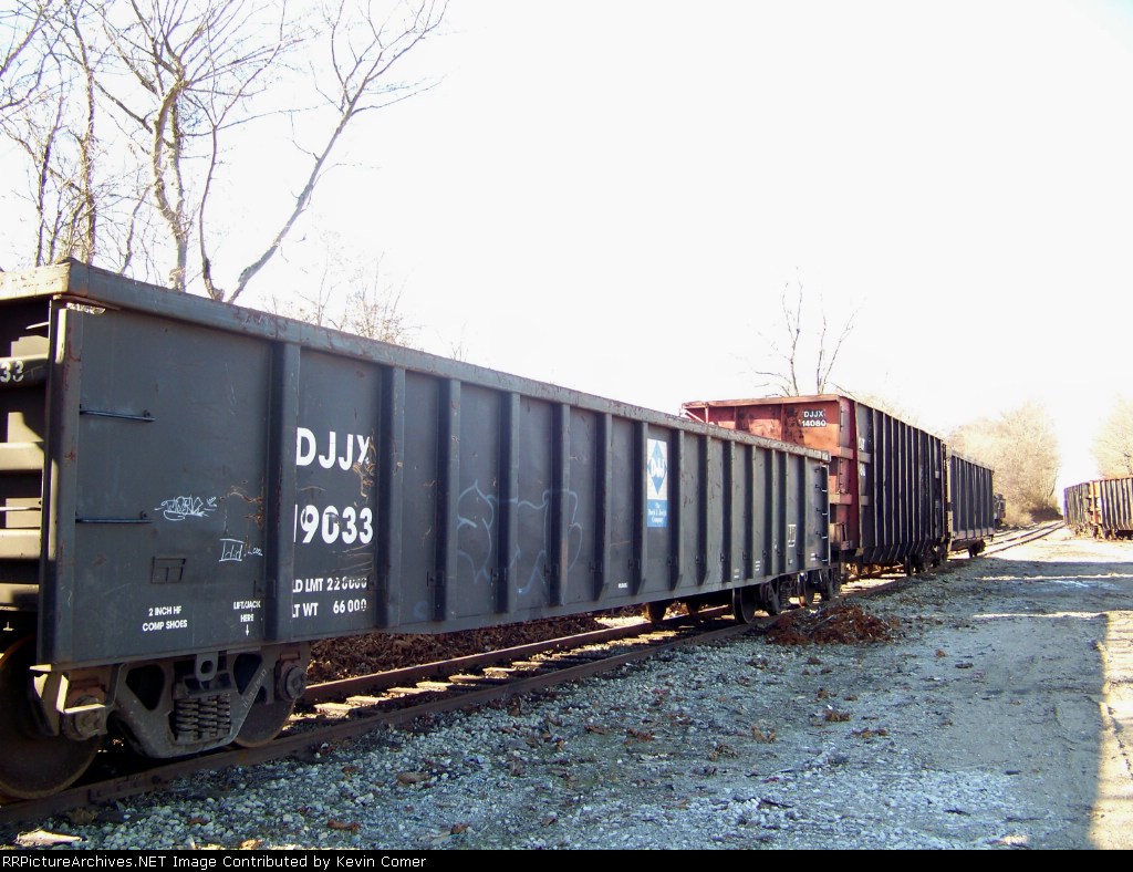 Gondolas sit beside piles of scrap metal to be loaded 1/1/2009