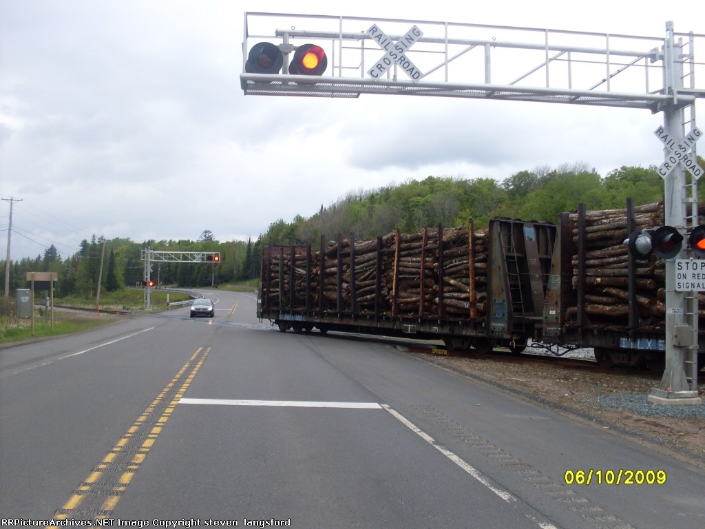 Loaded Pulpwood Cars Crossing US-41