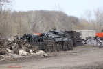 Rails, ties and plates sit waiting for all the new update in the yard