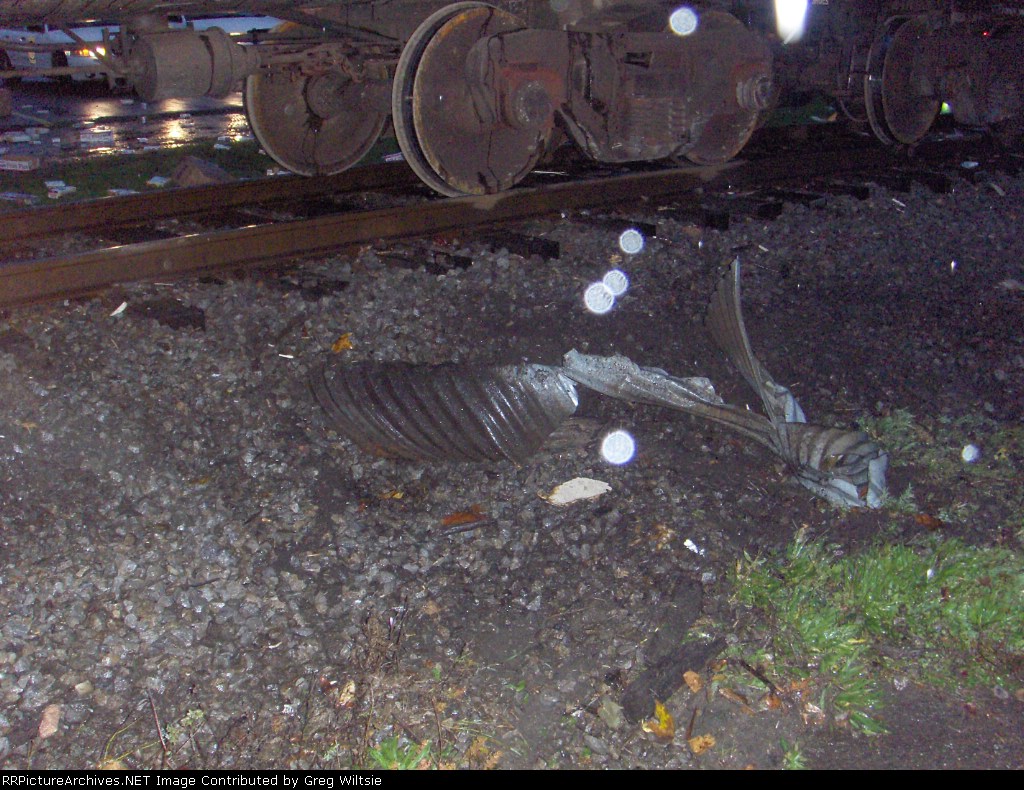 Damage to a trackside pipe from the train dragging the trailer