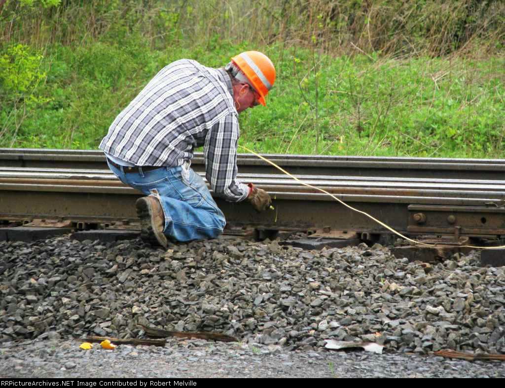 Marking bad rail section to be cut out and removed