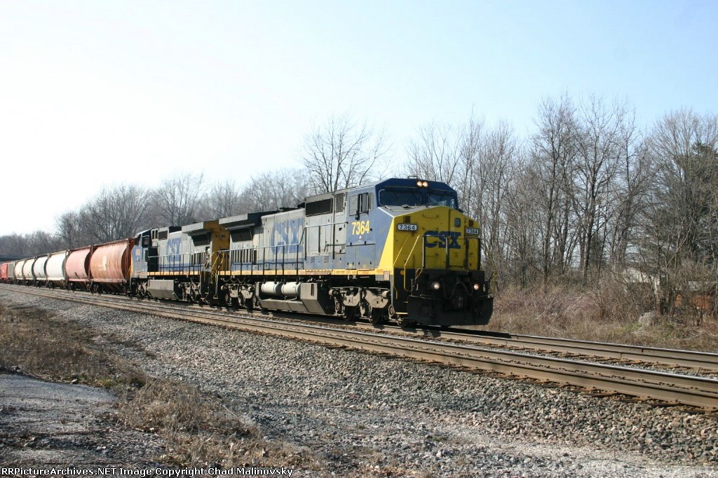 CSX 7364 climbs the hill with Q388