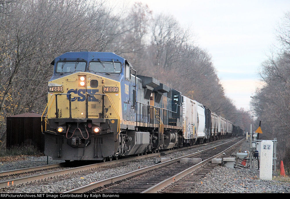 Westbound tonnage in the form of Q38519 is led by C40-8W 7889 as it ...