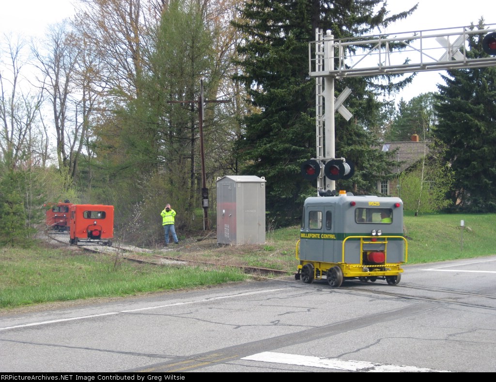 Another chaser takes some pictures as the cars pass over Route 66