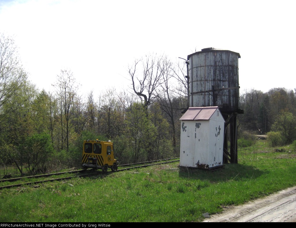 A speeder heads past the Russell City water tower