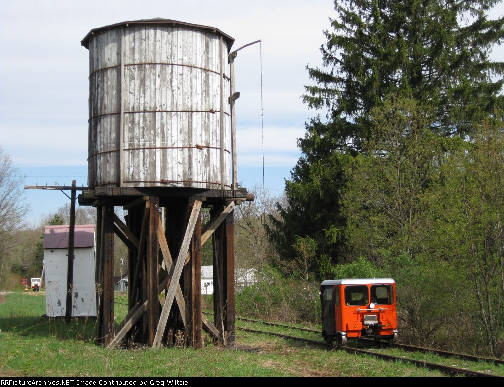 The cars start to pass by the old Russell City water tower