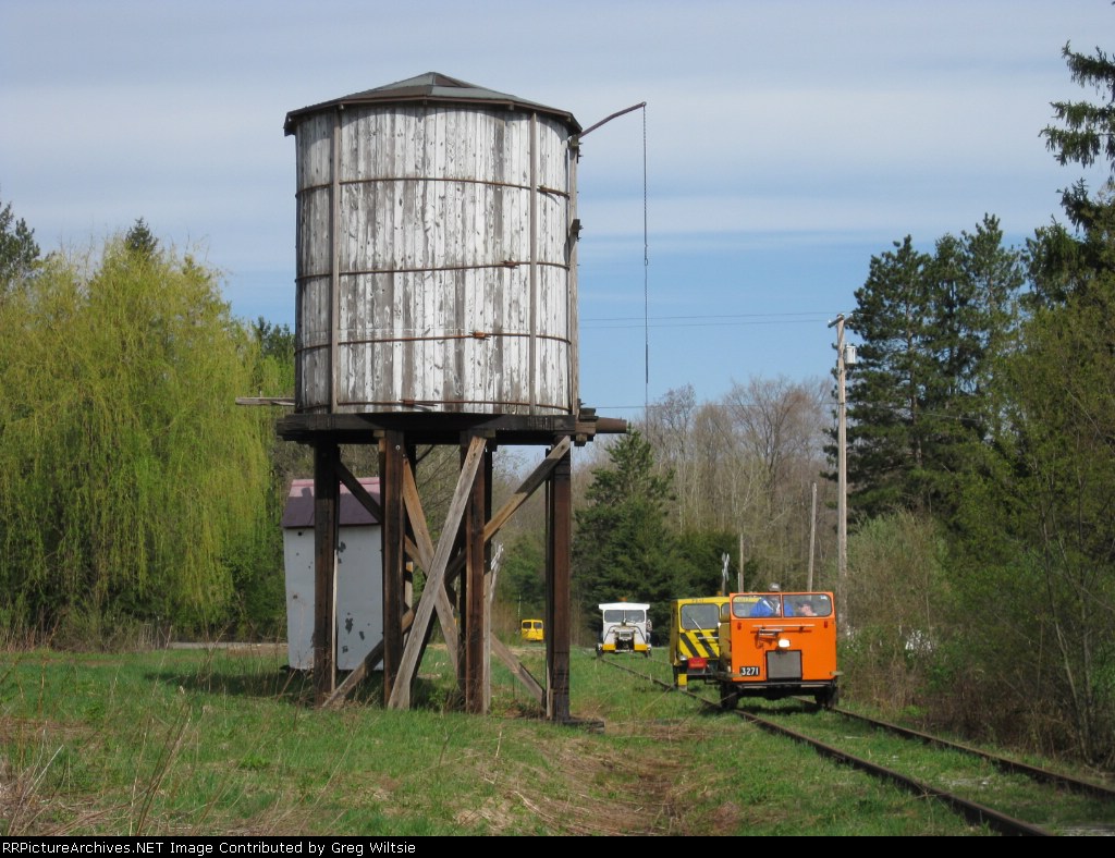 More cars pass by the Russell City water tower