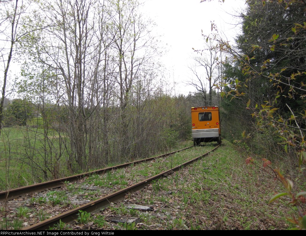 An A car rounds the curve just off the steel bridge