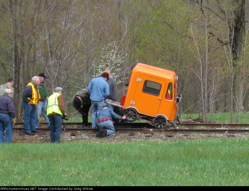 A broken axle is looked at on one of the speeders