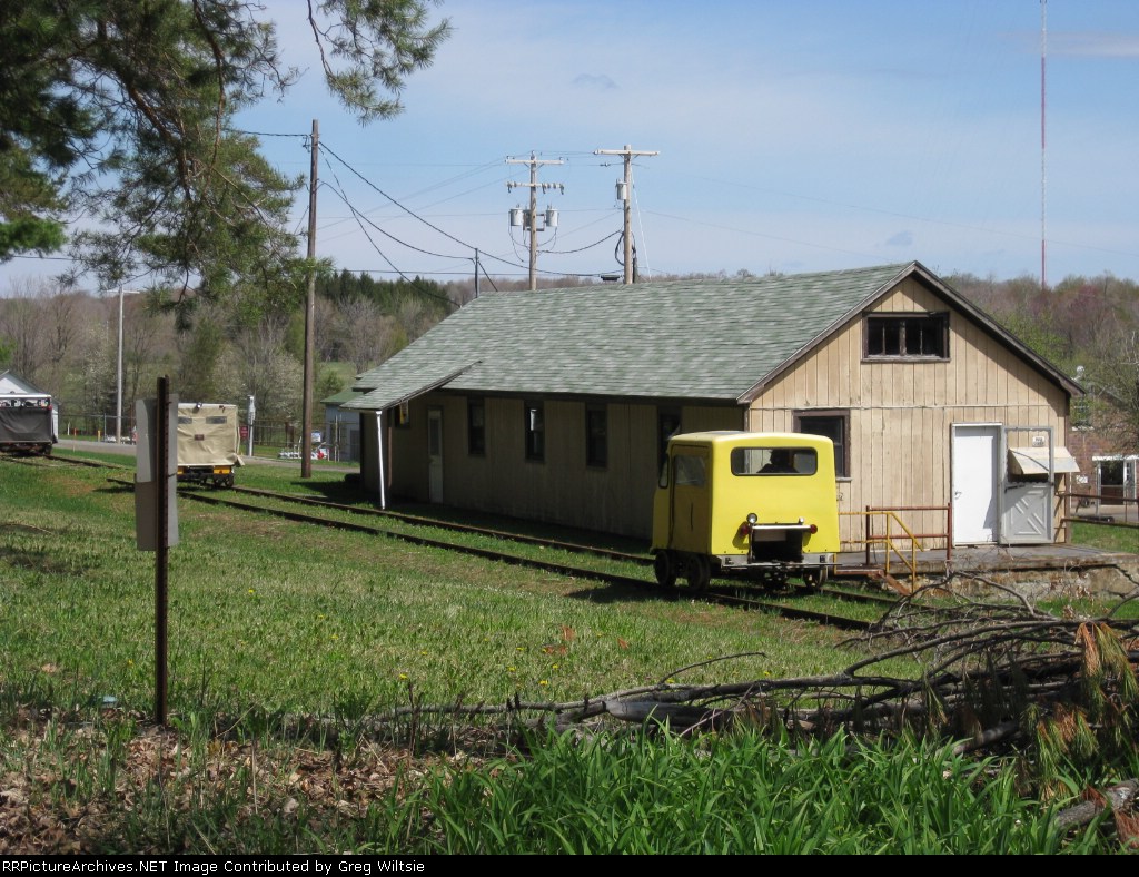 The speeders move past some buildings belonging to a gas company