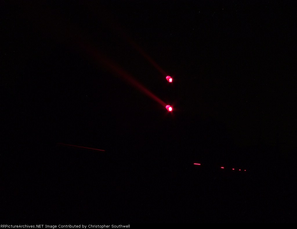 the caboose replacement on the rear of northbound empties passes MD South interlocking