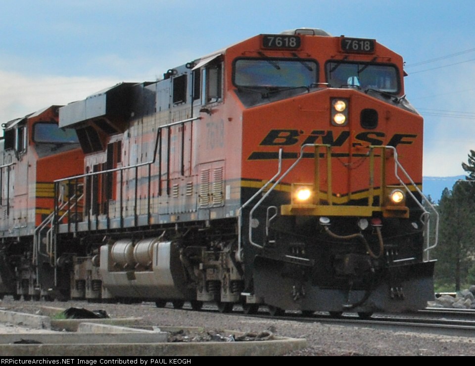 Close up of BNSF 7618 as she starts the grade towards Marias Pass, MT going east with a#load of empty container cars.