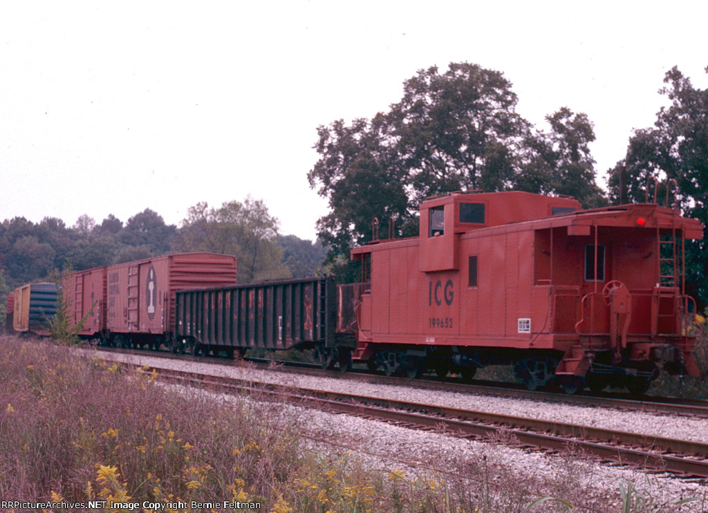 Illinois Central Gulf caboose #199652 brings up the rear of a Chicago bound train 