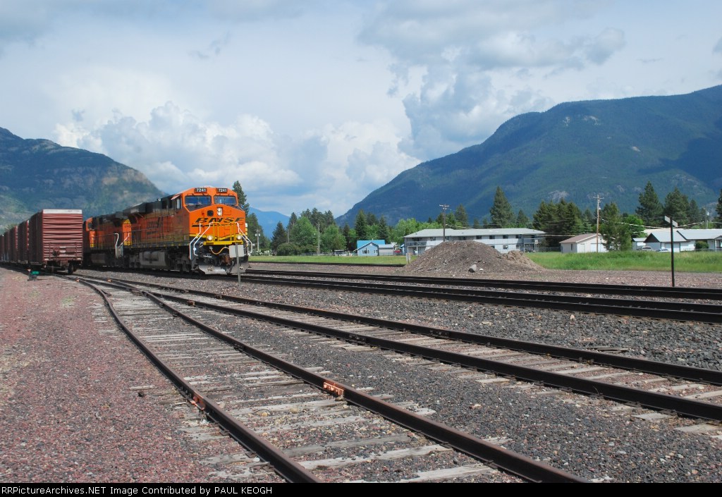 BNSF 7241 and Glacier Nationa Park in the background as comes off the downhill run off Marias Pass.