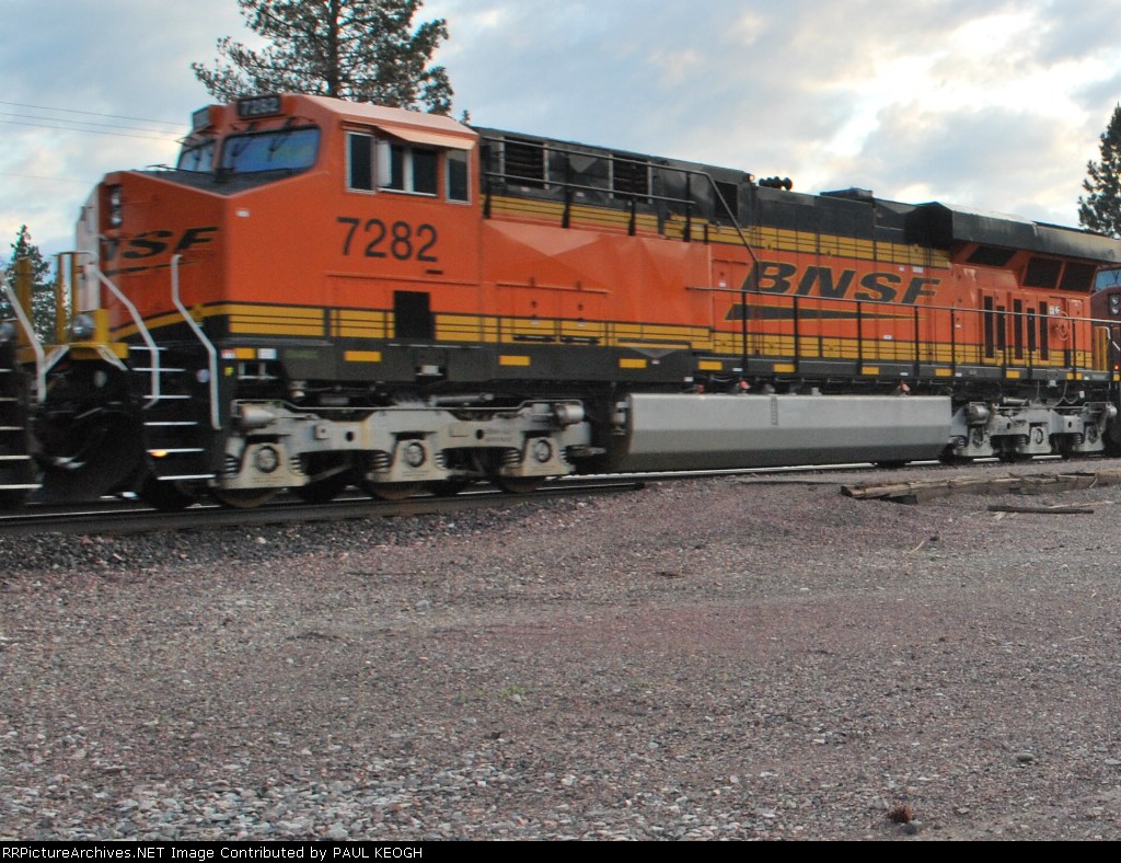 BNSF 7282 rolls east towards Marias Pass, Mt/as a #3 unit on a eastbound manifest.