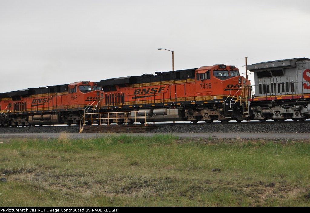 BNSF 7549 and BNSF 7416 pass me as they roll west into the Montana Rail Links (MRL) Helena yd.