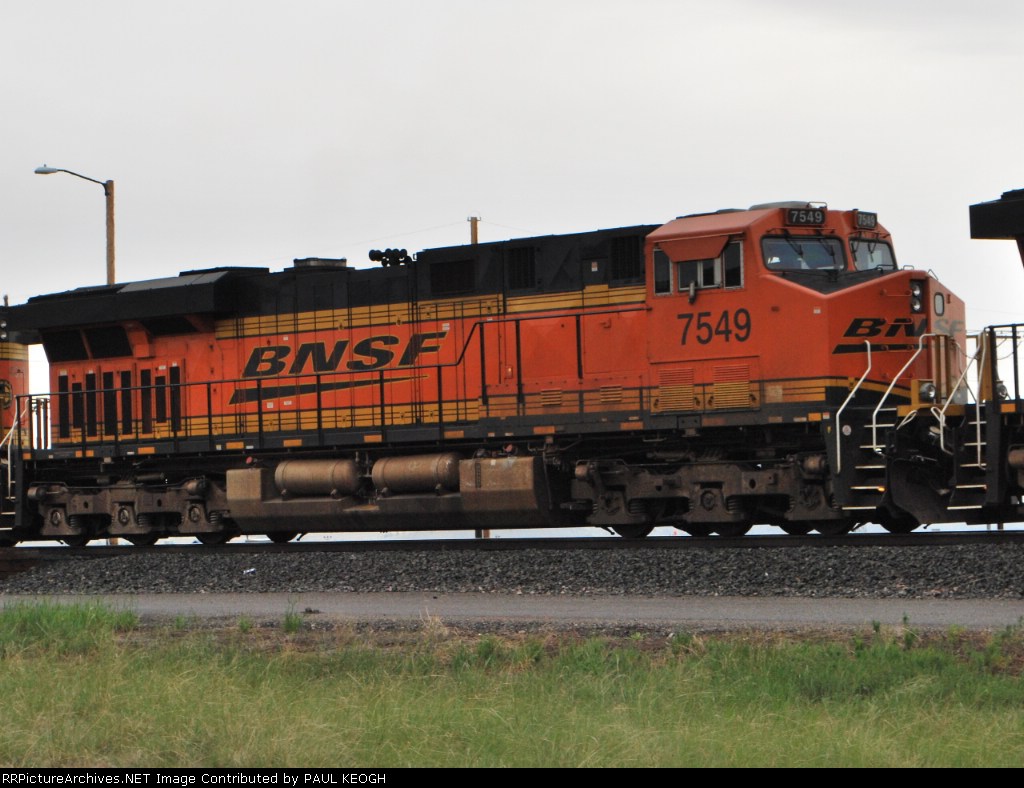 BNSF 7549 (ES44DC) rolls west as a 2d unit on a manifest train