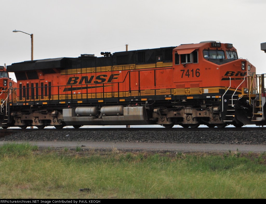 BNSF 7416 rolls west behind BNSF 7549 as a 3d unit on a manifest train.