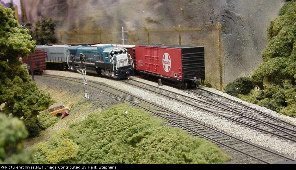 Picture Four---FRED marks the end of the NS freight as the Georgia Midland train prepares to head north on a day that will find more time in the siding than on the main due to many extra trains on the NS line.