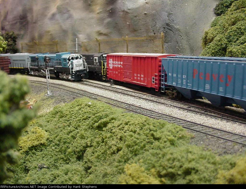 Picture Three--Georgia Midland RR detour train sits as NS continues into the siding.The GAMS units is an RPP shell upgraded to a C36-7.