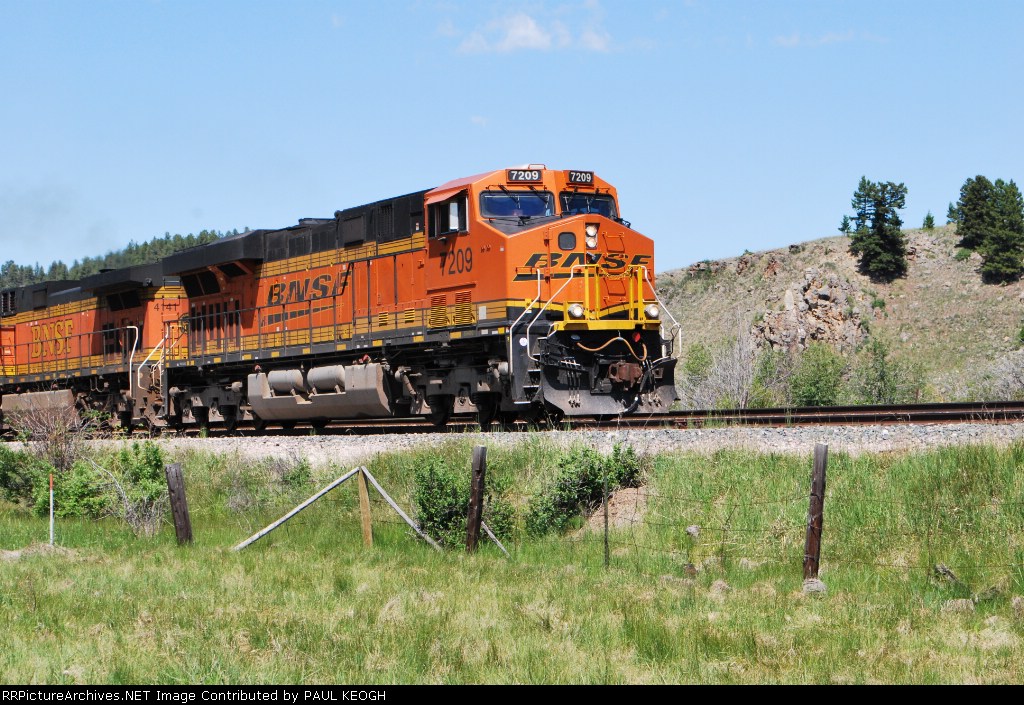 BNSF 7209 leads a eastbound manifest uphill towards Helena, Mt.