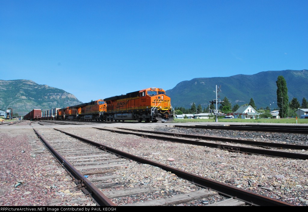BNSF 7322 with BNSF 7323 and 7324 cross the r/r crossing.
