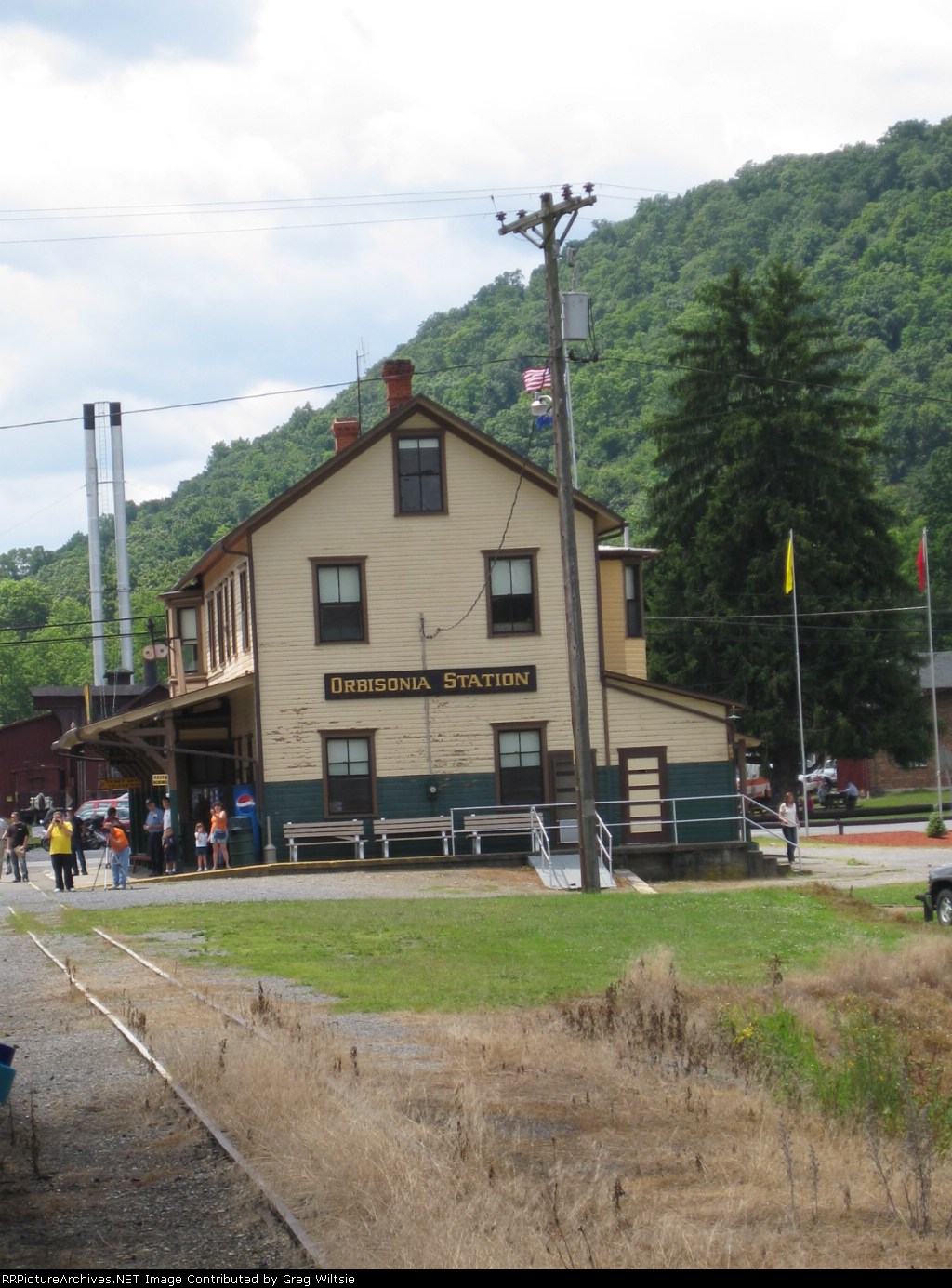 Photographers watch at the station as the train passes