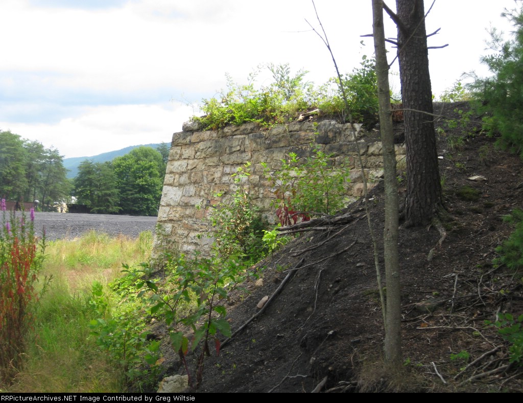 Old wall for something near the yard and shops
