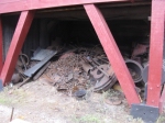 Some scrap steel stored under one of the buildings