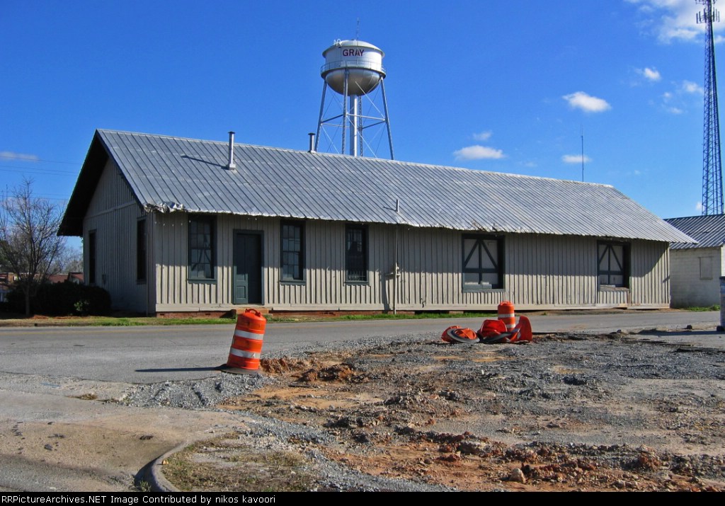 Gray depot and watertower