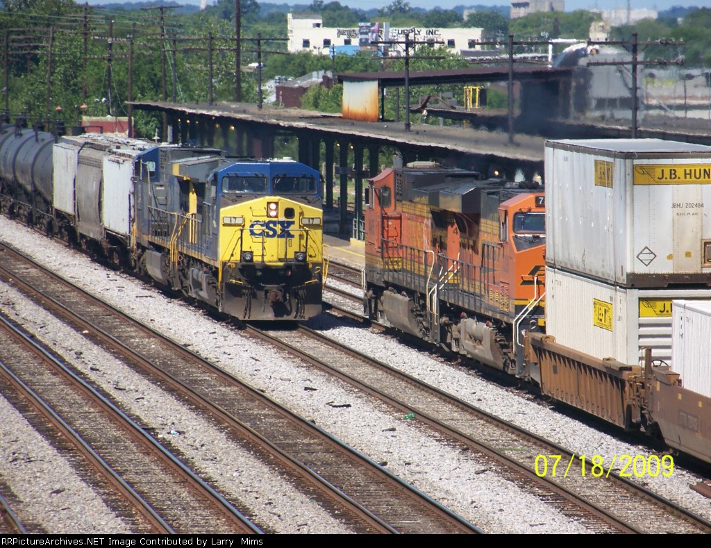Soundbound Q185 with BNSF power passing Q680 Northbound at Birmingham