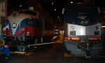 F10 sitting beside a former Amtrak P40