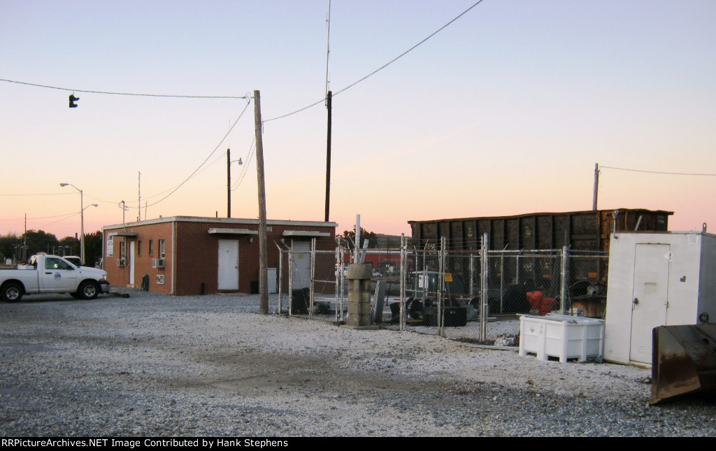 Fenced Signal Maintainers lot near brick agency