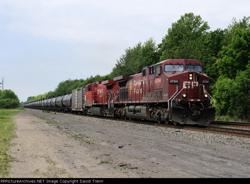 CP 9784 leads Eastbound CSX K678 at Harmon Rd MP QD 120 on track number two.