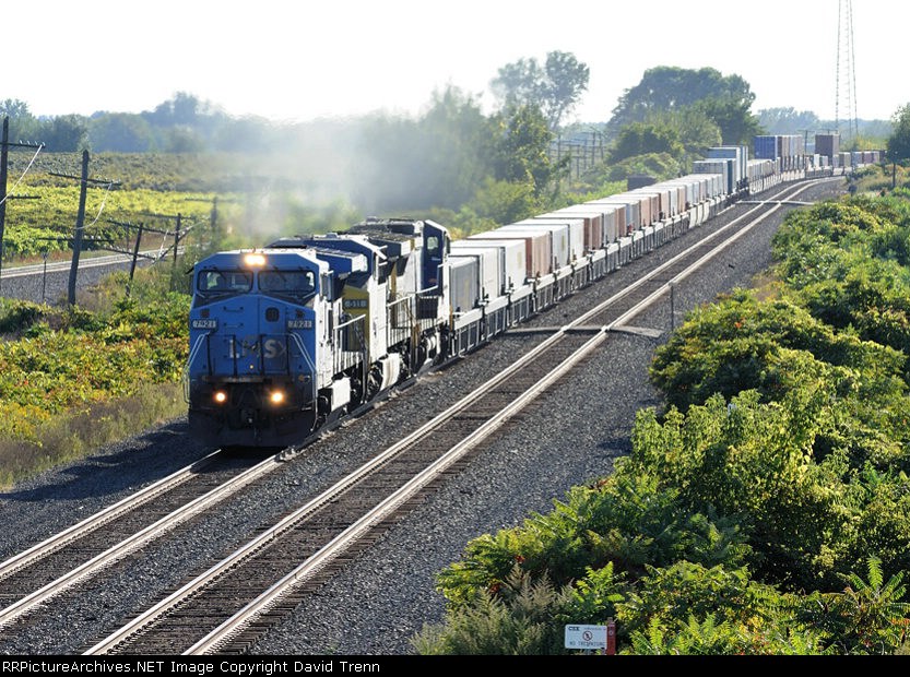 CSX (LSMX) #7921 leads Eastbound CSX Q122 at MP 70 on track number two