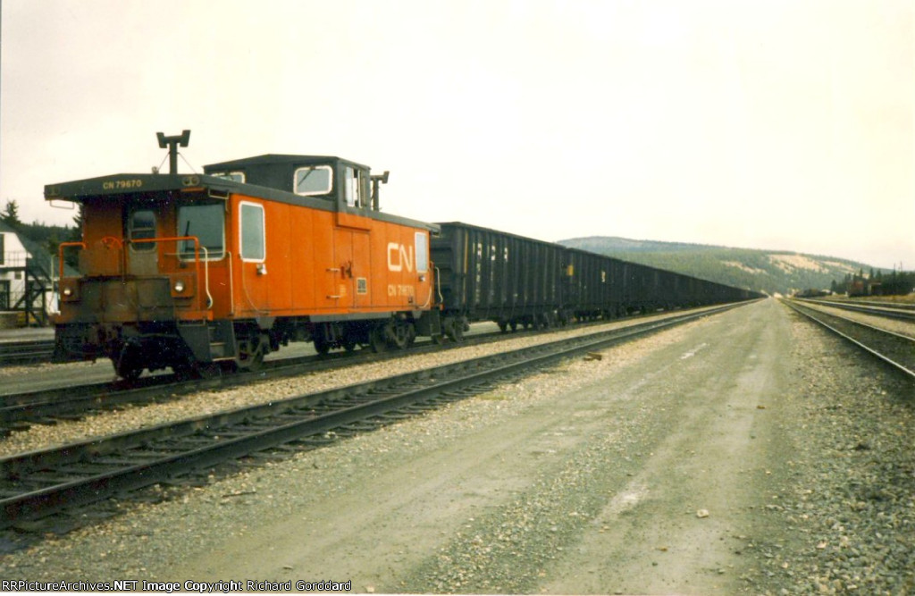 A CN Caboose and lots of coal hoppers