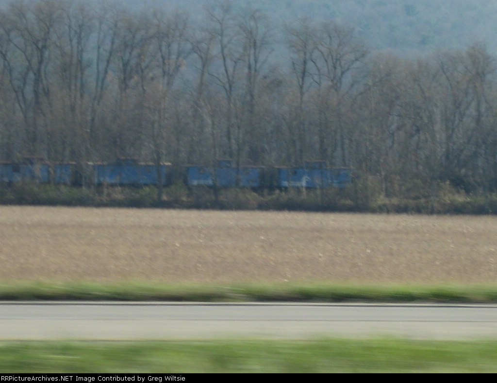 Some of the former Conrail cabooses stored along the tracks in Avis