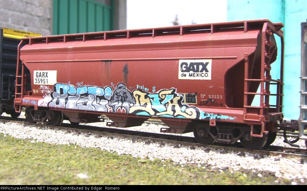 GARX 35951. A GATX de Mexico covered hopper, weathered and tagged with some graffiti
