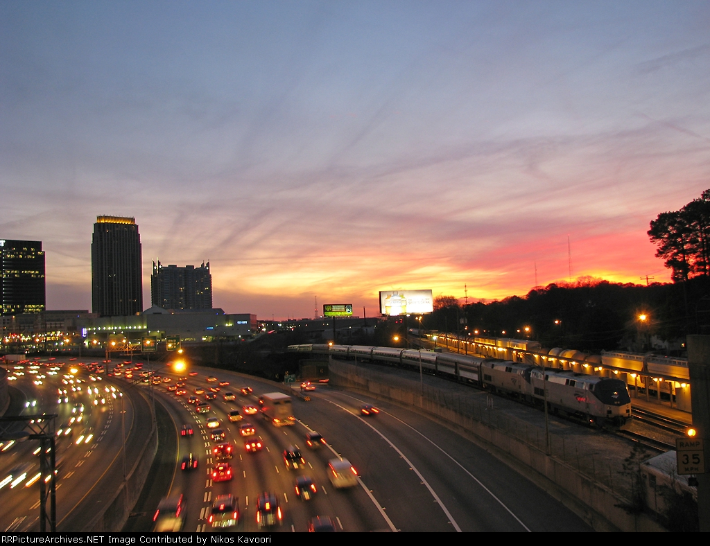 AMTK 20 waits for its call to duty while trafic rushes past on I-85/75