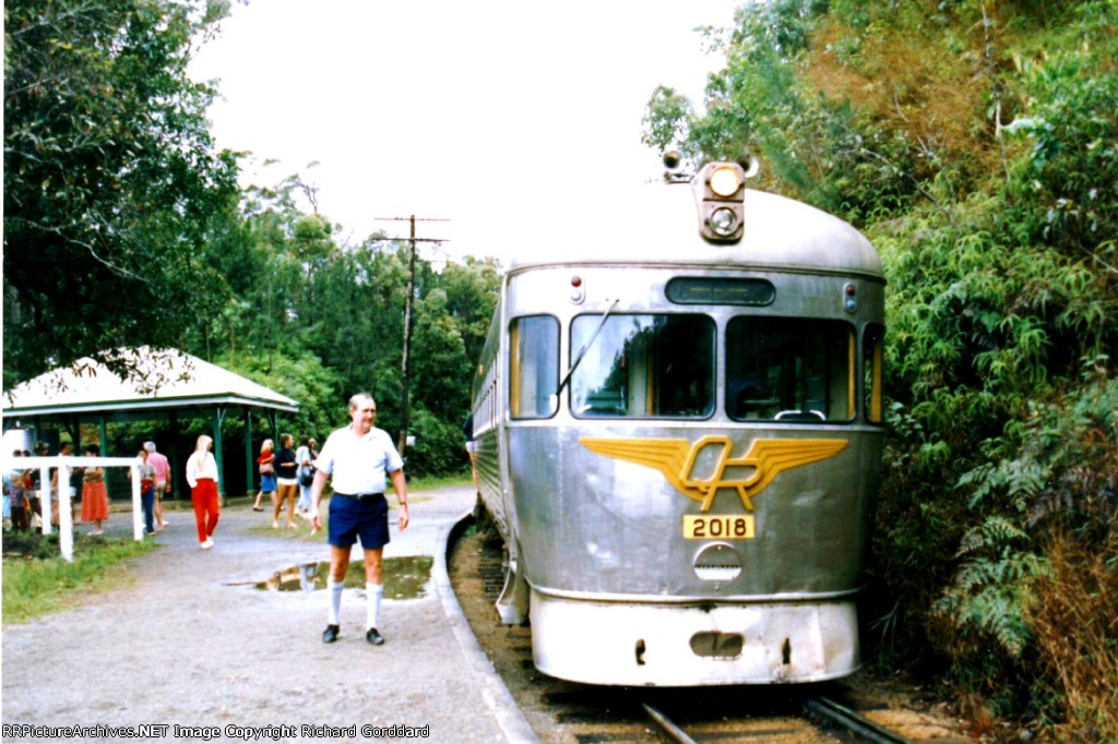 The gentleman standing next to the railcar is the operator 