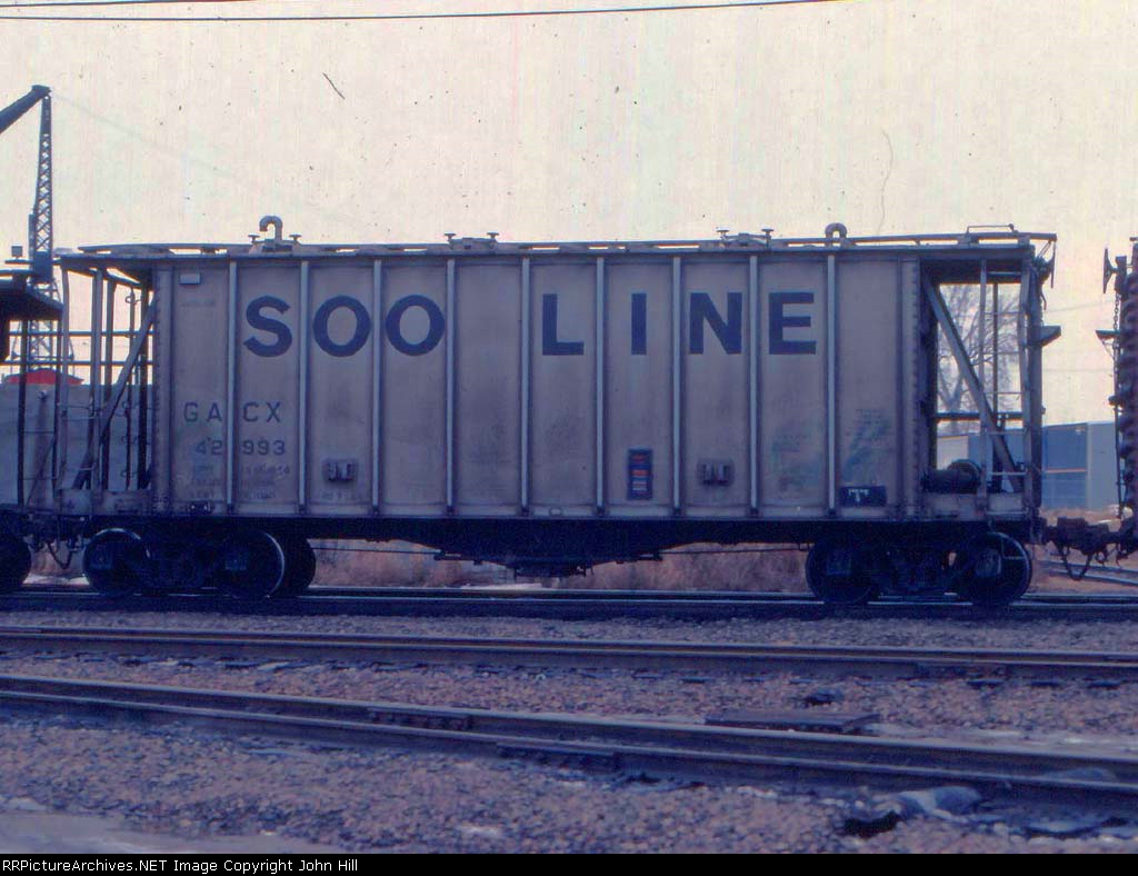 1126-36a GACX 42993 on eastbound C&NW transfer on BN passing Mpls GN Depot