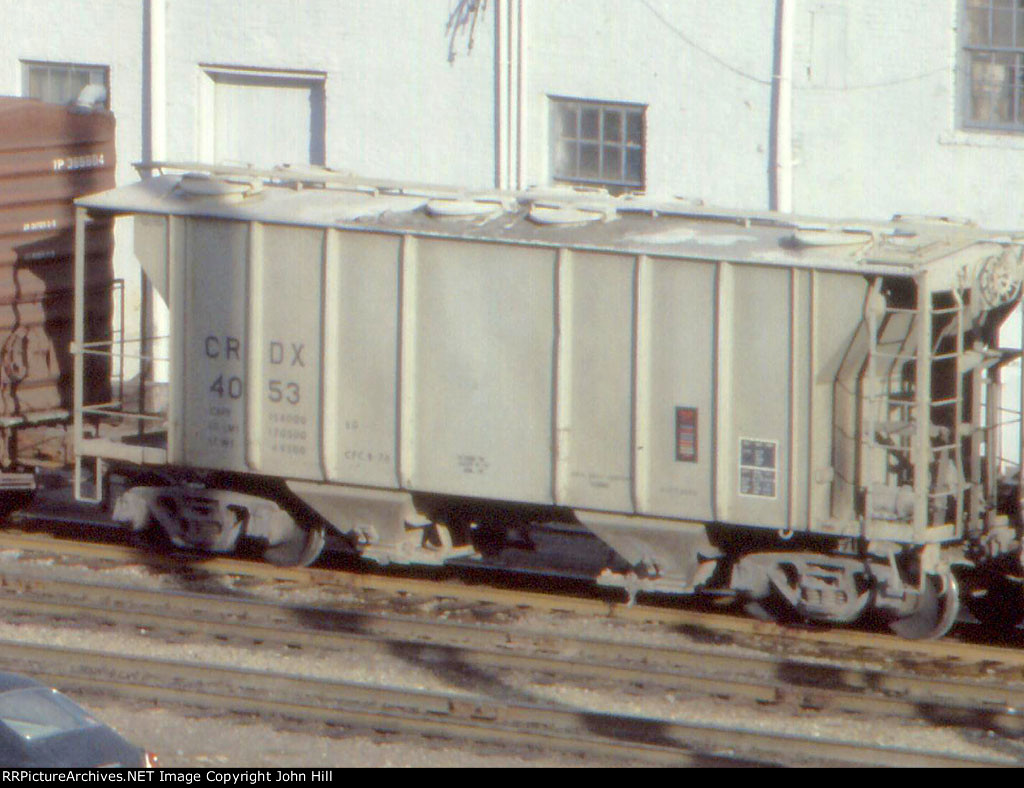 1209-18a CRDX 4053 seen on southbound BN freight from Edgewater Inn Hotel.